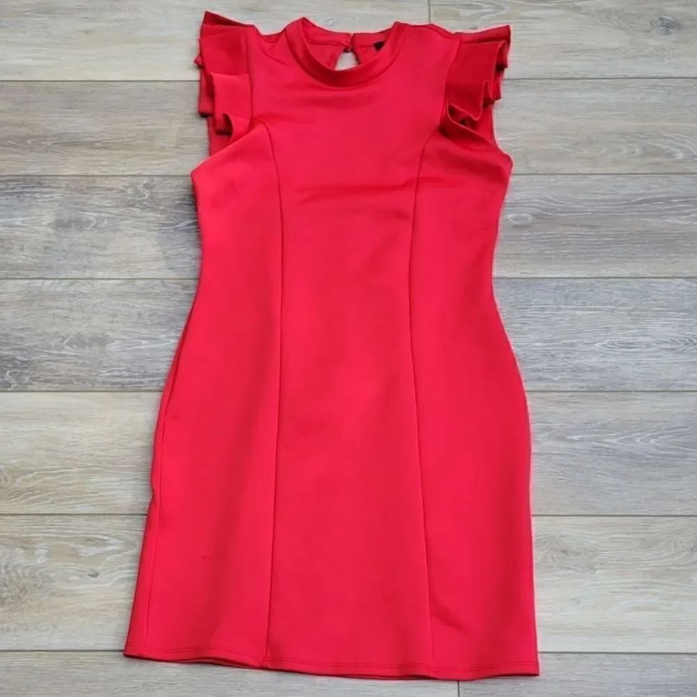 Leola Couture- Gorgeous dress in a red. Ruffled sleeve detail keyhole back